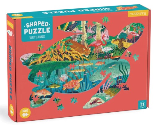 The Wetlands Shaped Puzzle by Mudpuppy features a vibrant illustration of wetland wildlife, including colorful fish, birds, and aquatic plants, in a uniquely shaped jigsaw design. The box displays the puzzle pieces in a fun turtle shape, showcasing intricate details and vivid colors, promoting environmental awareness and creativity for both kids and adults.