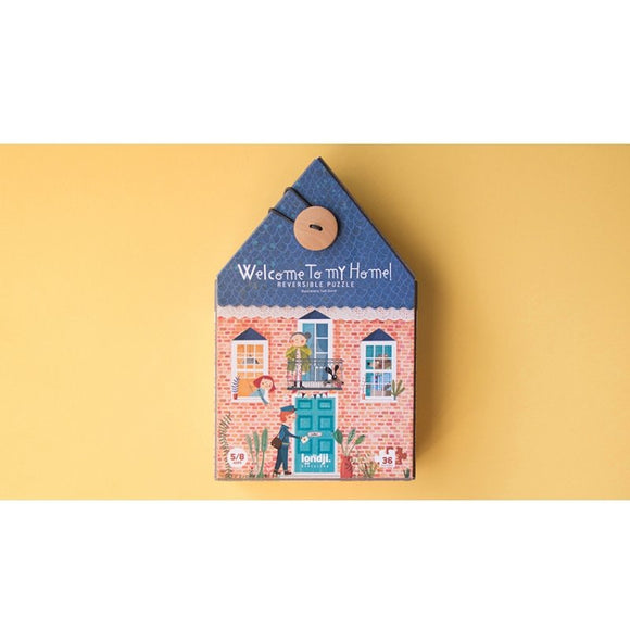Welcome to My Home reversible jigsaw puzzle by Londji, featuring colorful illustrations of a house with playful characters and pets. Packaged in a house-shaped box with a button clasp, designed for engaging and imaginative play. Contains 36 pieces suitable for various skill levels.
