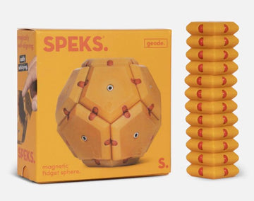 The Speks Geode: Solar Flare is a magnetic fidget sphere featuring a vibrant orange and yellow design. The box showcases the unique geometric shape, emphasizing its tactile and visually engaging features. Next to the box, there are additional magnetic pieces stacked vertically, highlighting the fun and interactive nature of the product. Perfect for fidgeting and stress relief.