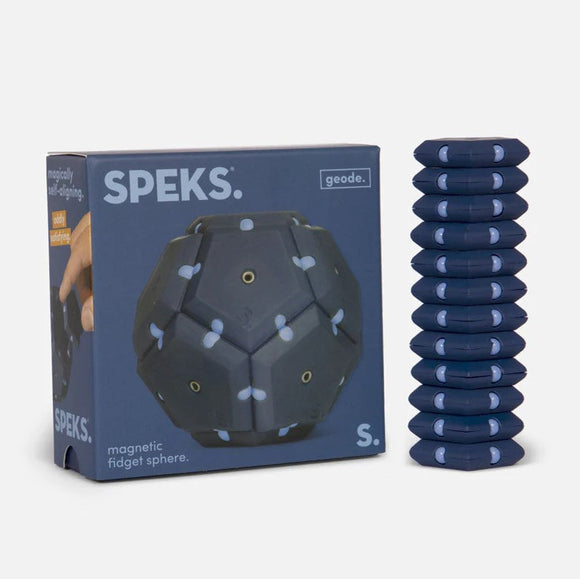 The Speks Geode: Space Cadet is a unique magnetic fidget sphere, displayed in its blue packaging. The product features a textured spherical design with small magnetic points, allowing for interactive play. Next to the box, there's a stack of magnetic hexagonal pieces, designed for fidgeting and stress relief.