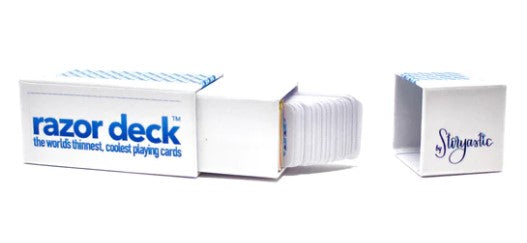 The Razor Deck by Storyastic features extremely thin playing cards housed in a sleek, white box with a vibrant blue logo. The box is open, revealing a stack of thin cards inside, showcasing the innovative design of the world's thinnest playing cards, perfect for card games on the go.