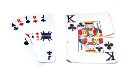 A set of Razor deck thin playing cards featuring an ace of spades, a seven of diamonds, a nine of hearts, and a king of clubs. The cards showcase bold graphics and are designed for a variety of card games, emphasizing quick and strategic gameplay.