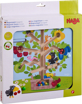 The Magnetic Game Orchard by Haba features a colorful magnetic tree with various fruits and animated animal characters. Children can use magnetic pieces to pick fruits from the tree, engaging in interactive play. The game is designed for kids aged 2 and up, promoting fine motor skills and creativity through hands-on interaction.