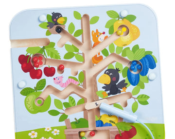 The Magnetic Game Orchard by Haba features a vibrant wooden tree with colorful fruits and playful animal characters. Children maneuver magnetic pieces along a winding path, enhancing fine motor skills and cognitive development. The design is engaging and supports imaginative play, making it an ideal game for young children.