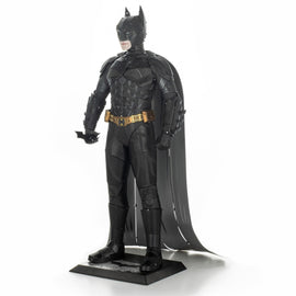 The Dark Knight Metal Model Kit by Fascinations, showcasing a detailed 3D representation of Batman in his iconic black suit and cape. The model features intricate metallic detailing, including Batman's emblem and belt, providing a stunning DIY experience for fans and collectors. Perfect for displaying or for enthusiasts who appreciate craftsmanship.