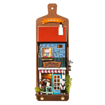 Aroma Toast Lab by Robotime is a charming DIY kit featuring a detailed miniature bakery facade. The kit includes a base with a blue and red building, complete with whimsical characters, vibrant flowers, and a signboard. Perfect for creative projects and enhancing fine motor skills.