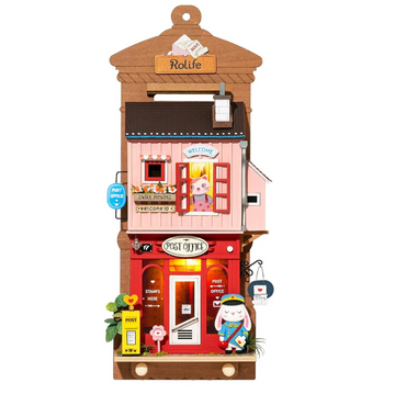 The Love Post Office is a charming DIY kit by Robotime, designed in vibrant colors. It features a whimsical post office building with detailed elements such as an open sign, stamp box, flower pots, and a cute character in a post officer outfit. The setting has windows adorned with intricate designs, enhancing its playful aesthetic. This engaging model provides a delightful crafting experience for both adults and children alike.