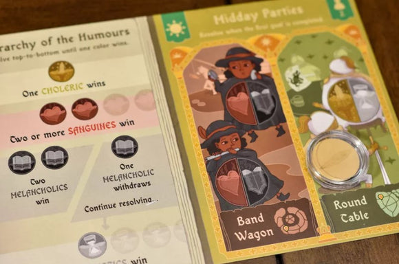Close-up view of the game 'Four Humours' by Adam's Apple Games. The image showcases colorful game components featuring illustrations of characters with shields, gameplay instructions, and various colored icons indicating win conditions based on different personality traits.