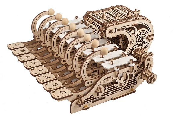 Ugears 3D Mechanical Celesta, a beautifully crafted DIY mechanical model featuring wooden levers and keys resembling a musical instrument. The intricate design showcases fine craftsmanship and offers an engaging build experience.