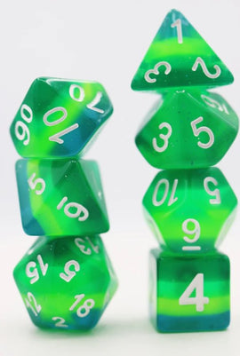 Tortoise Shell RPG Dice Set by Foam Brain, featuring a vibrant mix of green and blue colors. This set includes various polyhedral dice like d20, d12, and d6, each with clear white numbers for easy readability, perfect for tabletop gaming enthusiasts.