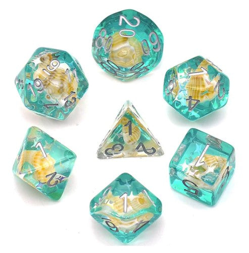A vibrant Green Conch RPG Dice Set featuring seven polyhedral dice made by Foam Brain. The dice are transparent green with seashell details inside, including a d20, d12, d10, d8, d6, d4, and a percentile die. The engraved numbers in a metallic finish offer a stunning contrast against the colorful dice, perfect for tabletop gaming enthusiasts.