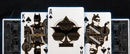 Batman Dark Knight Card Deck by Theory 11 featuring intricate designs. The King of Spades depicts Batman in a dynamic pose, while the Ace showcases a striking bat symbol surrounded by stylish patterns. The deck features detailed illustrations of the iconic characters, offering both a visual treat and a premium playing experience.