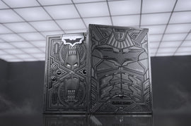 Batman Dark Knight Card Deck by Theory 11 featuring striking black and silver designs on the front and back. The cards showcase iconic Batman imagery and intricate patterns, perfect for collectors and card enthusiasts.