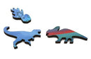 Close-up of three colorful jigsaw puzzle pieces from the Volcano#3 jigsaw puzzle by Grant Haffner. The pieces include a blue dinosaur, a comet, and a striped dinosaur, showcasing intricate designs and vibrant colors.