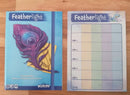The Featherlight game by Wizkids features a beautifully illustrated cover with a colorful feather and eye design, emphasizing a whimsical aesthetic. The game includes a scoring sheet on the right with labeled sections for card entries, ideal for tracking gameplay. This visual representation captures both the artistic elements and the functional components of the game.