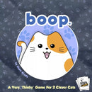 The game 'Boop.' by Smirk And Dagger features an adorable cartoon cat character in a playful design. It's marketed as a 'very thinky' game suitable for 2 players, set against a soft blue background with playful paw prints.