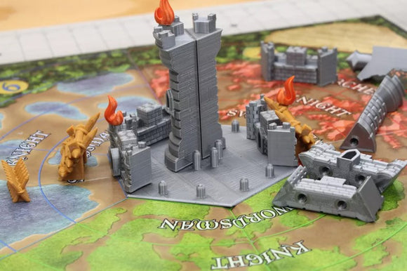 Castle Panic: 2nd Edition game components displayed. Features a central tower with flames, surrounded by various castle pieces and knights on a colorful game board. Ideal for strategy lovers.