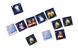 A colorful layout of cards from a game by Sit down! titled Fairy Lights. The cards feature whimsical illustrations of fairy creatures and fruits set against a dark, starry background. Some cards depict cute characters like a rabbit and a glowing apple, arranged in a playful pattern, emphasizing the enchanting theme of the game.