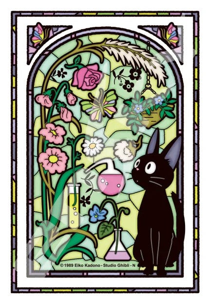A colorful stained glass illustration featuring Jiji, the black cat from Kiki's Delivery Service, surrounded by various flowers and potion flasks in a sunlit room. The vibrant colors and intricate details capture the whimsical essence of the beloved Studio Ghibli film.