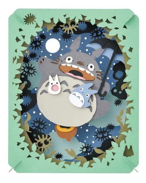 An illuminated Paper Theater featuring Totoro and his friends in a whimsical night scene. The design showcases intricate cutouts of trees and stars, with the characters beautifully crafted in layers. This DIY kit by Ensky brings a touch of magic to any space when illuminated.
