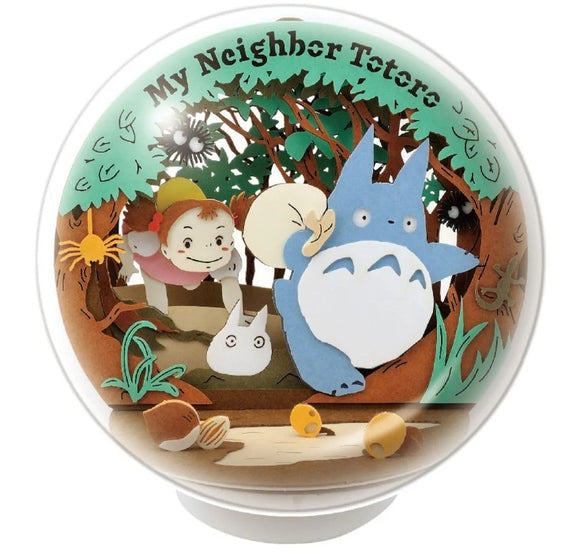 A beautifully crafted Paper Theater diorama depicting characters from 'My Neighbor Totoro' in a lush forest setting. The scene features Totoro, a small forest spirit, alongside Mei, a young girl, and other woodland creatures, all surrounded by vibrant greenery. This intricate DIY kit allows fans to create a charming display full of whimsy and nostalgia.