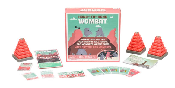 Hand-to-Hand Wombat board game by EXPLODING KITTENS featuring colorful tower pieces, rule cards, and game instructions. Players build and wreck towers using strategy. Perfect for family game nights and fun gatherings.