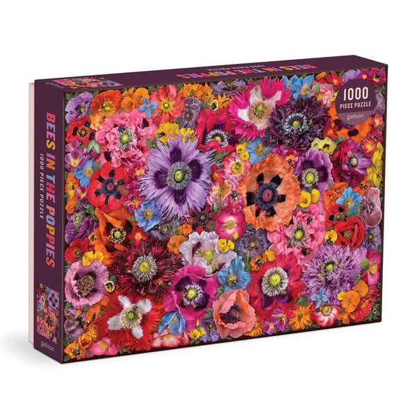 Bees in the Poppies jigsaw puzzle by Galison featuring a vibrant collage of colorful flowers. The puzzle consists of 1000 pieces, showcasing a variety of blossoms in shades of pink, purple, and orange, creating a lively and cheerful design.
