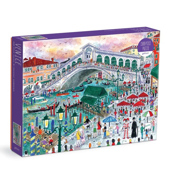 The Michael Storrings Venice jigsaw puzzle by Galison features a vibrant illustration of Venice's iconic landscape. It depicts the famous Rialto Bridge bustling with tourists, gondolas gliding through the canals, and lively market scenes, all illustrated in bright colors. The puzzle consists of 1500 pieces and comes in an eye-catching box that showcases the artwork.