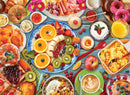 A colorful jigsaw puzzle depicting a breakfast table filled with a variety of delicious foods. The image showcases an array of fruits including oranges, bananas, and berries, along with pastries like croissants and donuts, and dishes like scrambled eggs, yogurt, and granola. The vibrant colors and detailed presentation create an inviting and appetizing scene perfect for breakfast lovers.