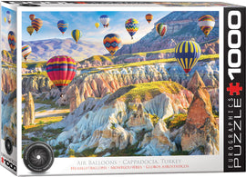 A vibrant jigsaw puzzle featuring breathtaking air balloons floating over the unique rock formations of Cappadocia, Turkey. The puzzle showcases an array of colorful hot air balloons set against a stunning backdrop of hills and valleys, inviting enthusiasts to piece together this picturesque scene. Made by Eurographics, this 1000-piece jigsaw puzzle is perfect for puzzle lovers and travelers alike.