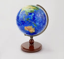 A 9-inch jigsaw puzzle globe titled 'Resplendent Earth' by Pintoo, featuring a vibrant blue and green map of the world. The globe is mounted on a classic brown wooden stand, showcasing detailed continent outlines and ocean names, perfect for educational fun and decor.