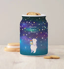 Dreams Come True 3D jigsaw puzzle jar by Pintoo featuring a whimsical design of a bear holding a jar of stars against a colorful night sky background. The jar is filled with cookies and rests on a wooden surface.