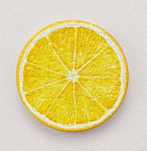 A vibrant 16-piece jigsaw puzzle depicting a detailed orange slice. The puzzle features bright yellow segments, showcasing the juicy texture of the fruit. Each piece is round, creating a circular image of the orange. Perfect for puzzle enthusiasts and citrus lovers.