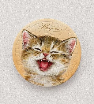 Kayomi 'Bright Smile' 16 piece Magnetic Puzzle featuring a cute, smiling kitten with vibrant fur and expressive features. The circular jigsaw pieces fit together seamlessly, creating a delightful image. Ideal for both children and adults, this puzzle combines fun and creativity.