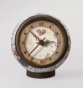 Manuscript Coffee 3D Jigsaw Puzzle Clock by Pintoo. This unique jigsaw puzzle features a clock design with intricate puzzle pieces forming the clock face, showcasing a blend of artistic details in earth tones. Perfect for puzzle enthusiasts and home decor lovers.