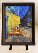 Vincent van Gogh's famous painting 'Cafe Terrace at Night' displayed as a jigsaw puzzle. The artwork features a vibrant night scene with a café illuminated in warm colors, surrounded by dark buildings and a starry sky, a perfect blend of art and puzzle fun.