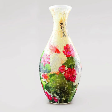 A beautifully crafted 3D jigsaw puzzle vase featuring vibrant pink lotus flowers and koi fish against a lush green background. This puzzle is designed by Pintoo and showcases intricate detailing, making it a stunning decorative piece once completed. Ideal for puzzle enthusiasts and art lovers alike.