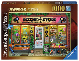 A colorful jigsaw puzzle box featuring a vibrant illustration of a vintage record store. The store's windows display various record albums and cassettes, with a sign stating 'Open' and lights around the entrance. A bench is positioned in front of the shop, complete with potted plants, creating a cozy ambiance. The box is branded by Ravensburger and contains 1000 pieces, promoting a fun and engaging puzzle experience.