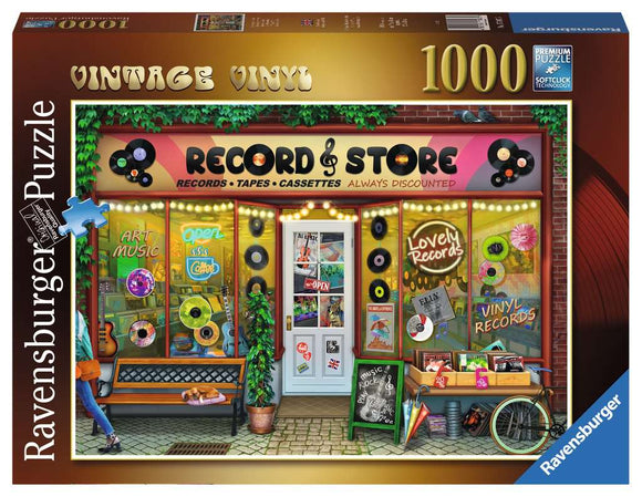 A colorful jigsaw puzzle box featuring a vibrant illustration of a vintage record store. The store's windows display various record albums and cassettes, with a sign stating 'Open' and lights around the entrance. A bench is positioned in front of the shop, complete with potted plants, creating a cozy ambiance. The box is branded by Ravensburger and contains 1000 pieces, promoting a fun and engaging puzzle experience.