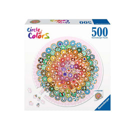 A colorful jigsaw puzzle titled 'Circle of Colors: Donuts' by Ravensburger, featuring a vibrant circular design made up of various donut shapes in a multitude of colors. The box includes 500 pieces and a bonus poster depicting the puzzle image.