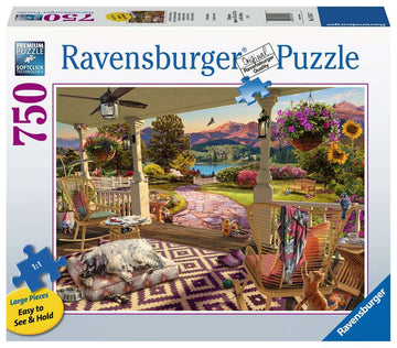 A cozy front porch scene depicted in a 750-piece jigsaw puzzle by Ravensburger. The image features a beautifully landscaped exterior with vibrant flowers, a picturesque pathway, and comfortable rocking chairs. A sleepy dog lies on a rug while a playful kitten sits nearby, inviting relaxation in this serene setting. Perfect for puzzle enthusiasts looking to create a charming outdoor scene.