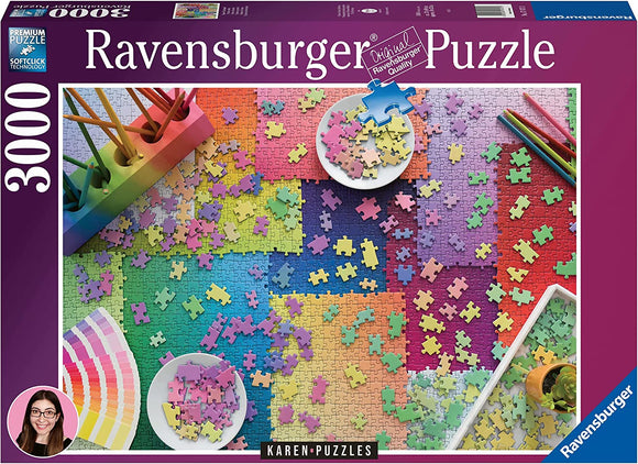 Ravensburger Karen Puzzles on Puzzles 3000 jigsaw puzzle featuring a vibrant and colorful assortment of puzzle pieces scattered across a gradient background. Includes bowls with pieces and arts supplies like colored pencils. Ideal for puzzle enthusiasts and families looking to enjoy a relaxing activity.