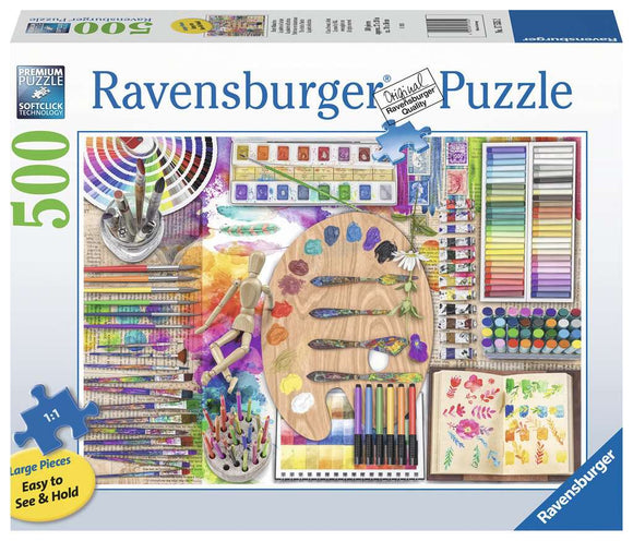 The Artist's Palette Large Piece Puzzle by Ravensburger features a vibrant collection of art supplies, including paintbrushes, watercolor tubes, a wooden palette with colorful paints, and various sketchbooks. The puzzle is designed with large, easy-to-handle pieces and showcases a creative and colorful art theme, perfect for art lovers.