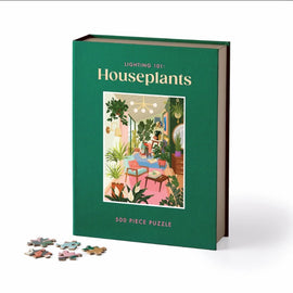 Lighting 101: Houseplants jigsaw puzzle by Galison, featuring a vibrant illustration of a well-lit room filled with various houseplants, books, and a cozy ambiance. Includes 500 puzzle pieces for an engaging experience.