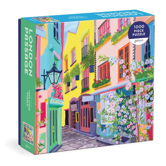 The London Passage jigsaw puzzle by Galison features a vibrant, colorful scene of a charming street lined with blooming flowers and beautifully painted buildings. The puzzle consists of 1000 pieces and showcases intricate details, making it a delightful challenge for puzzle enthusiasts.