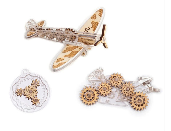 The Veter Models: Fidgets-1 kit includes intricate transparent and wooden pieces designed to create a vintage airplane and a mechanical motorcycle. The set features various gears and components that showcase a combination of engineering and creativity, perfect for DIY enthusiasts.