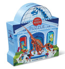 Colorful packaging of the Day at the Dinosaur Museum jigsaw puzzle by Crocodile Creek. Features a dinosaur skeleton illustration, children interacting at a museum, and vibrant dinosaur characters. Suitable for ages 4 and up with 48 pieces.