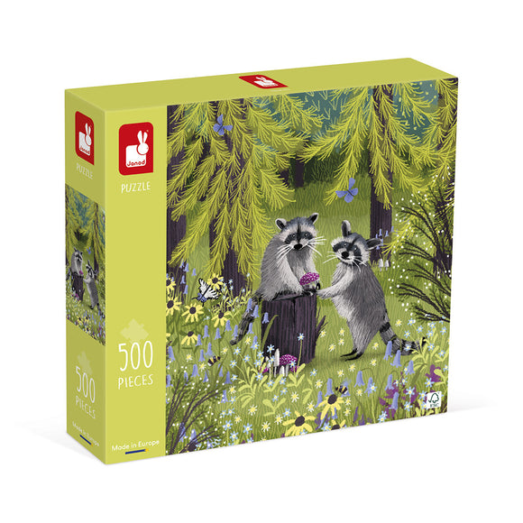 Raccoon Bandits jigsaw puzzle by Janod featuring a whimsical illustration of two raccoons interacting in a vibrant forest scene adorned with colorful flowers and trees. The puzzle contains 500 pieces and emphasizes fun for children and families.