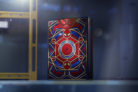 A beautifully designed deck of Spider-Man playing cards by Theory 11, showcasing vivid red and blue colors with intricate gold accents and Spider-Man symbols on the packaging.