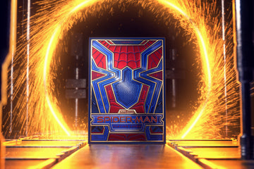 A vibrant image of Spider-Man Playing Cards by Theory 11, showcasing a dynamic box design featuring Spider-Man's iconic colors and emblem, set against a dramatic fiery backdrop.
